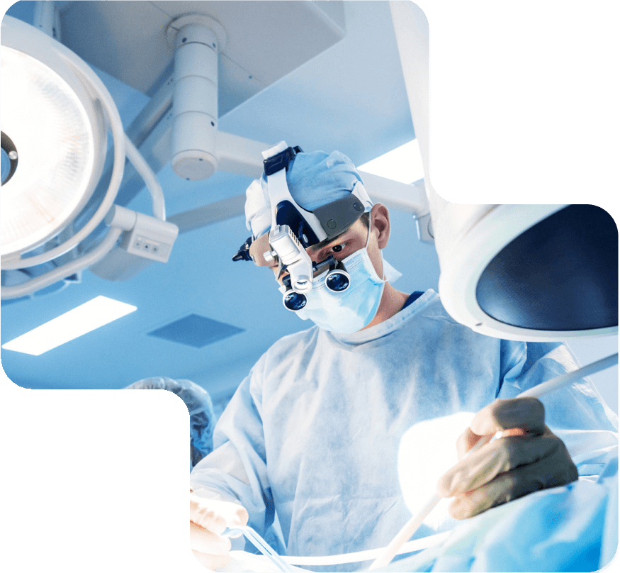 Home 7 Surgeon performing a medical procedure in a sterile operating room at Levantine Medical Center